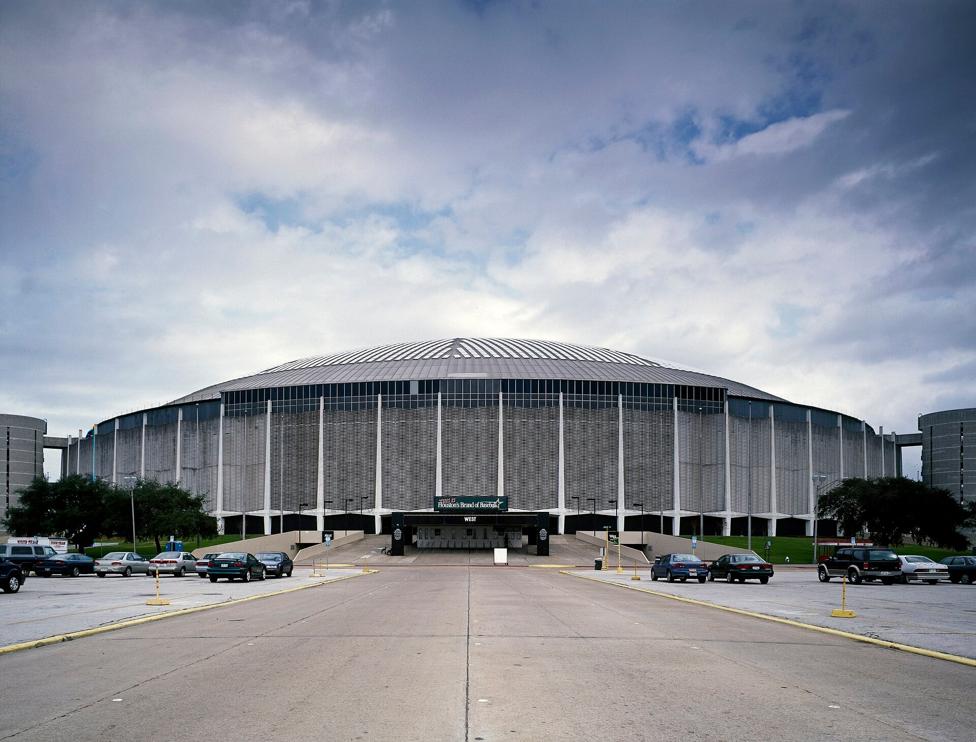 Exterior photograph of the Astrodome in Houston, Texas, showing its large domed roof, the world's first stadium built with a permanent dome.