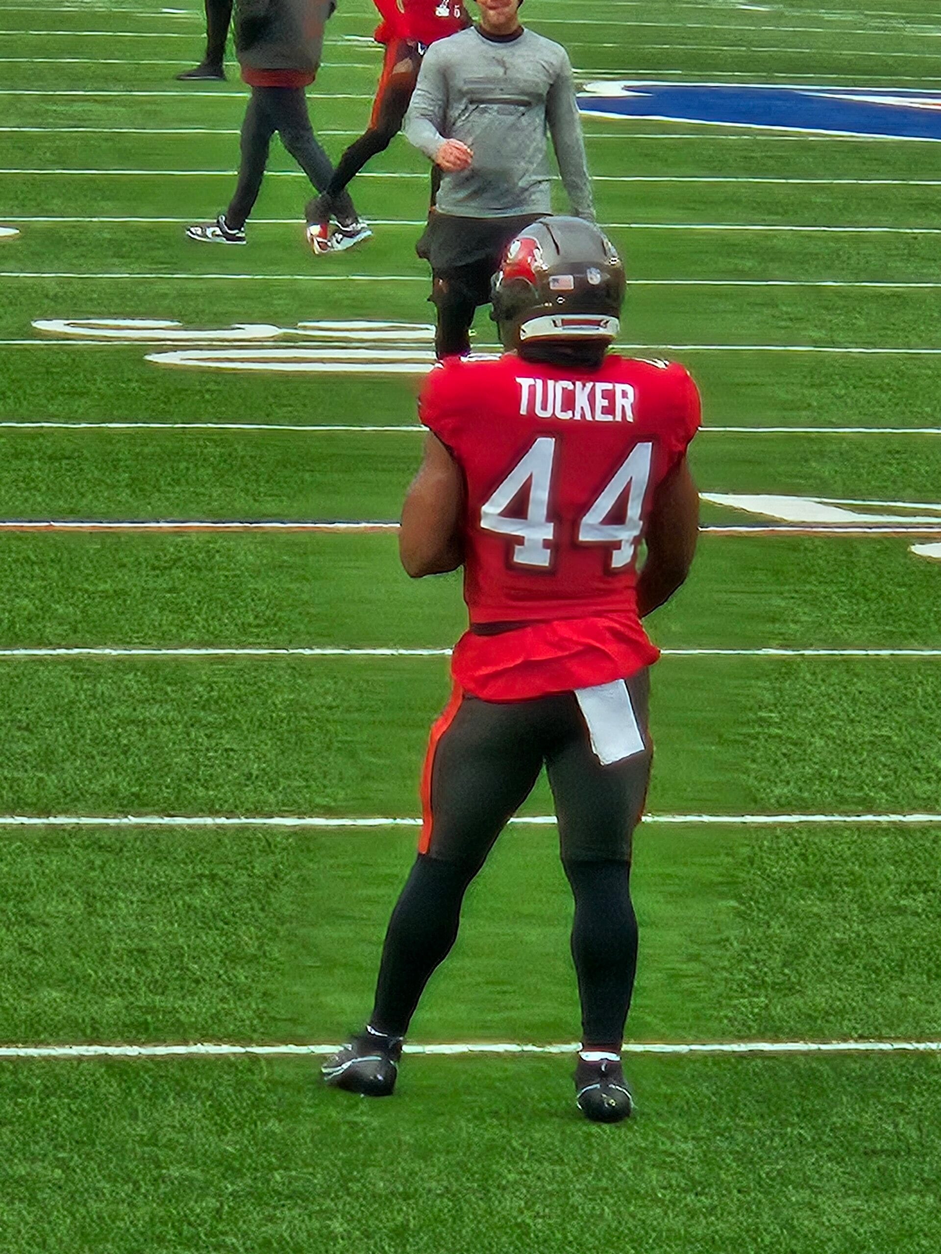 Tampa Bay Buccaneers running back Sean Tucker warming up in pewter and red gear before a 2025 game against the Buffalo Bills.
